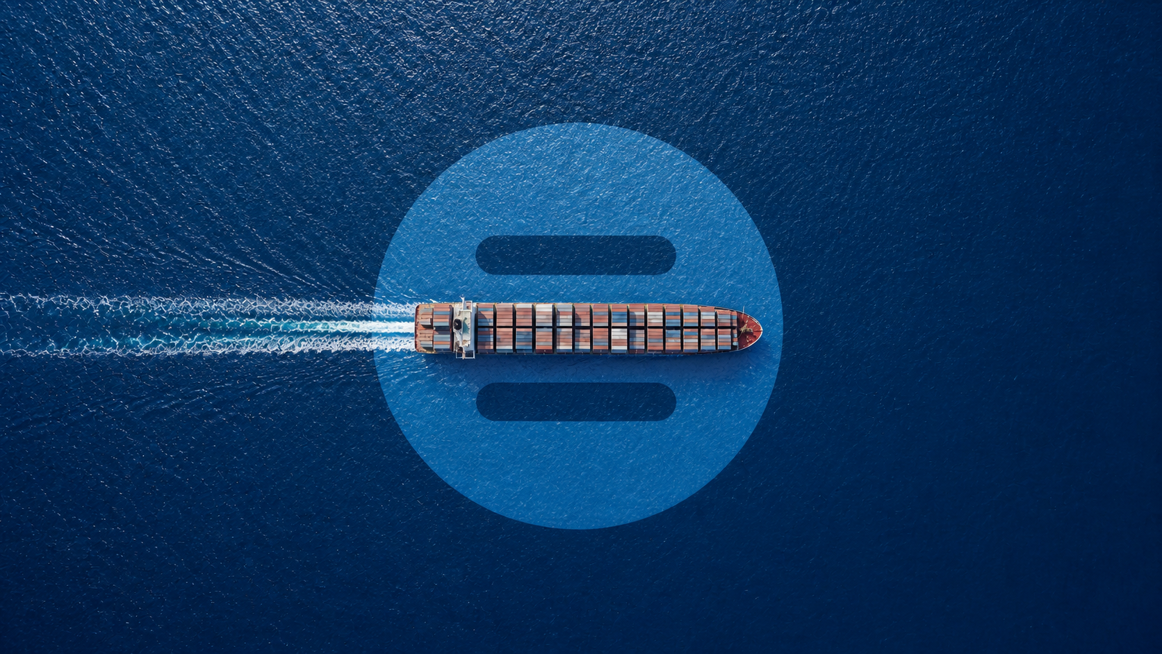 Container ship viewed directly from above on deep blue ocean